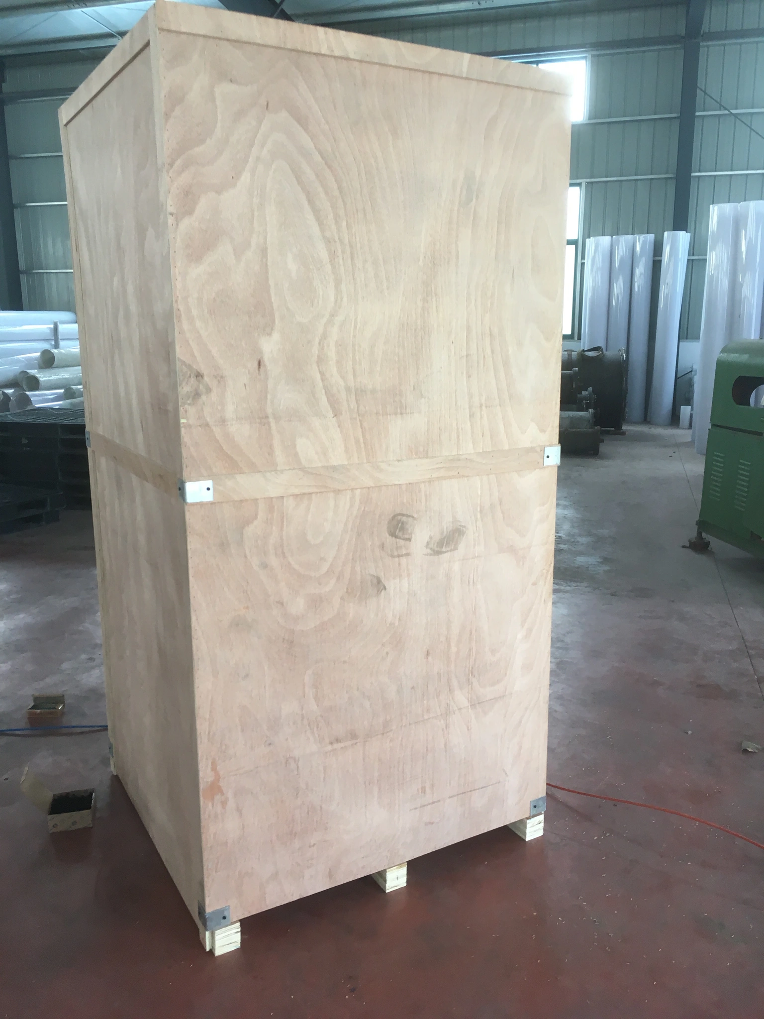 Closed wooden export crate prepared for acrylic cylinder shipment